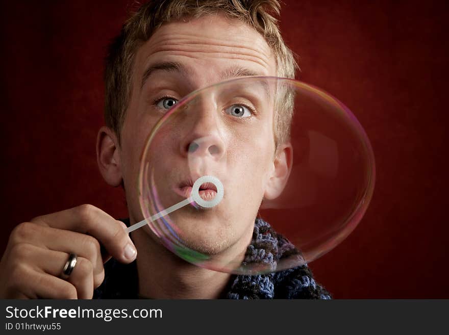 Young Man Blowing a Bubble