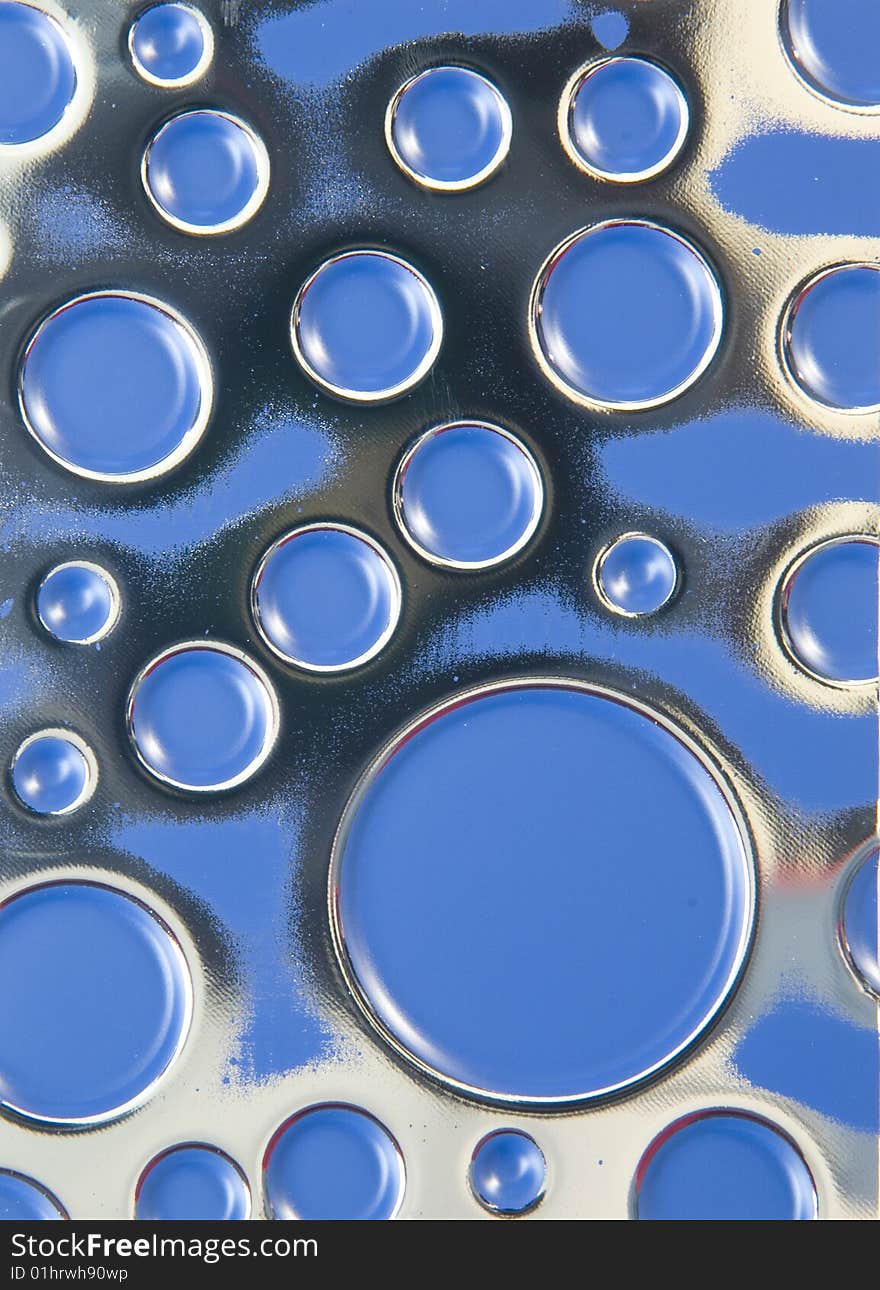 Background of blue textured metal with circles