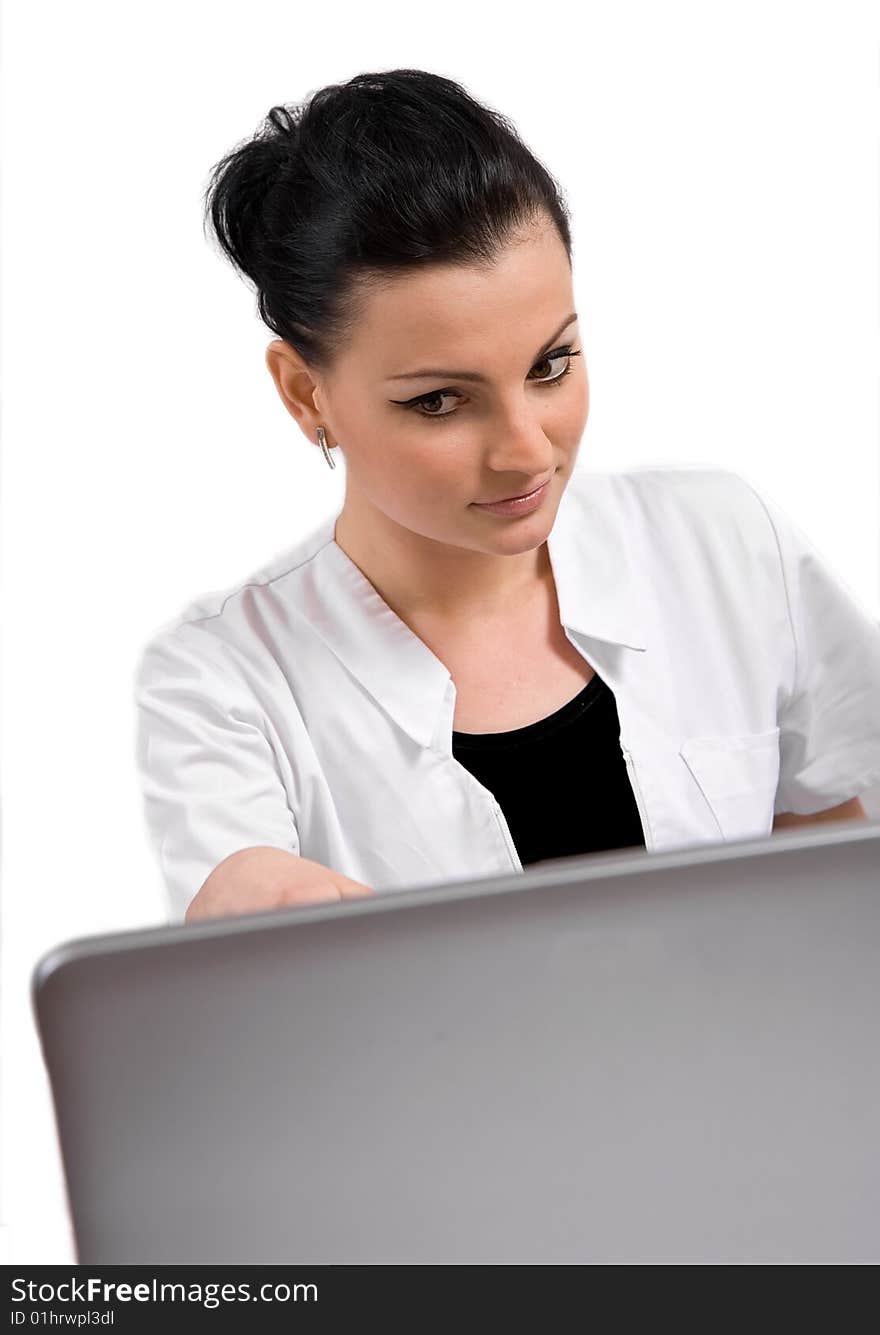 Young doctor is looking the laptop, isolated in white background. Young doctor is looking the laptop, isolated in white background