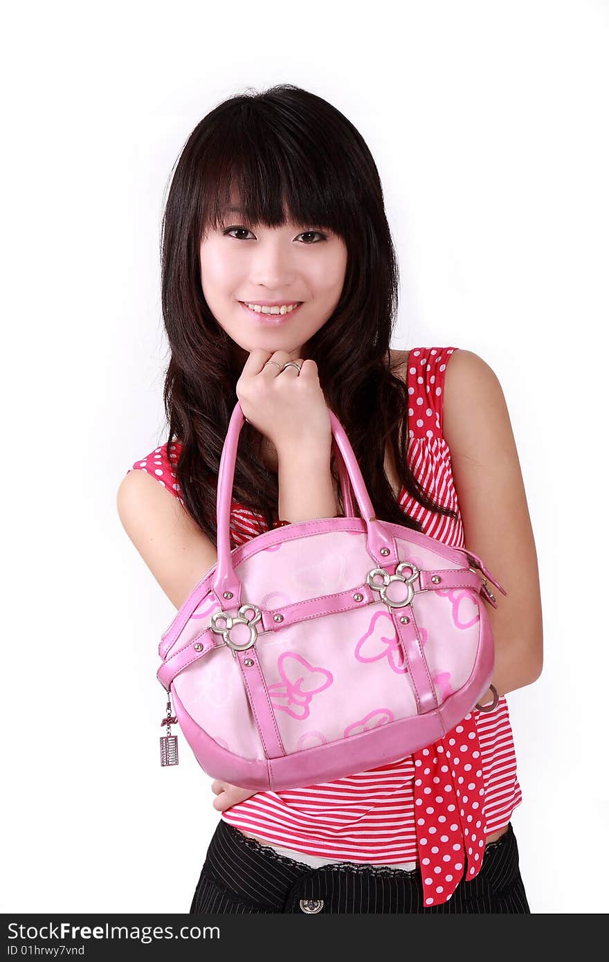 A beautiful Asian girl with pink handbag on white background.