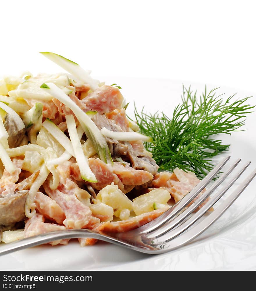 Salad Comprises Chopped Ham, Cucumber and Cheese Dressed Dill. Isolated on White Background