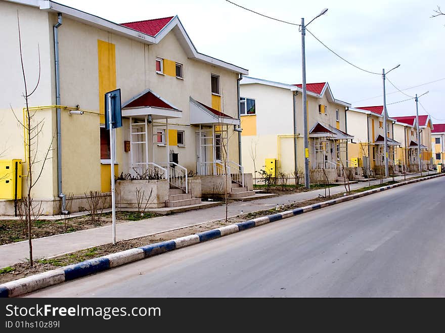 New houses on a street side. New houses on a street side