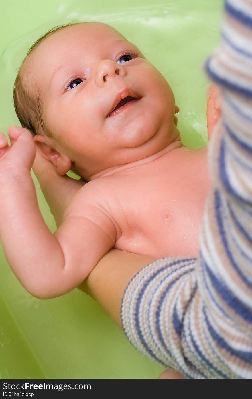 Adorable infant (a boy) in bath - soft focus