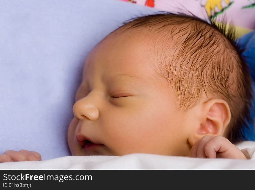 Caucasian baby boy sleeping - face close-up