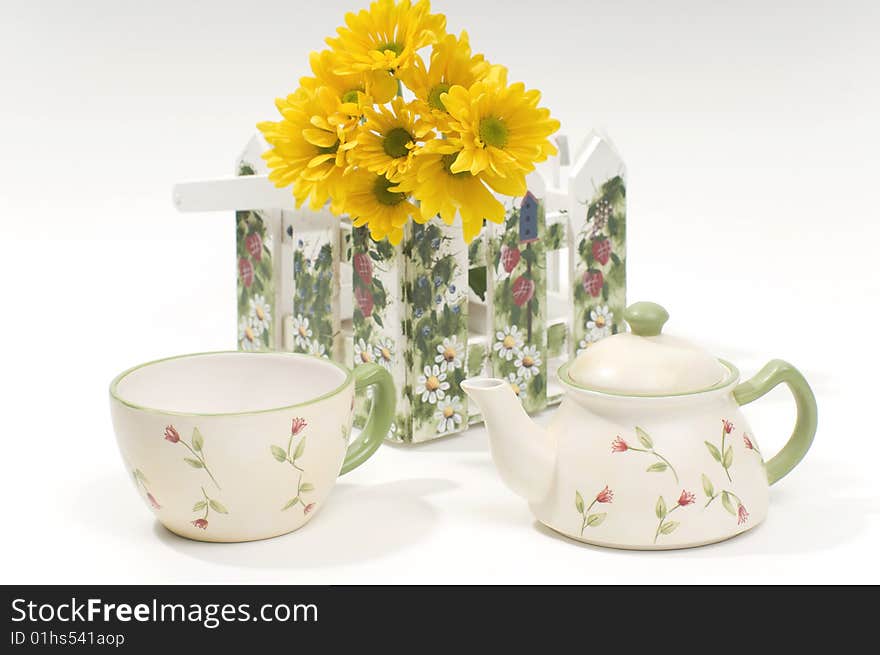 Teapot And Cup With Yellow Flowers