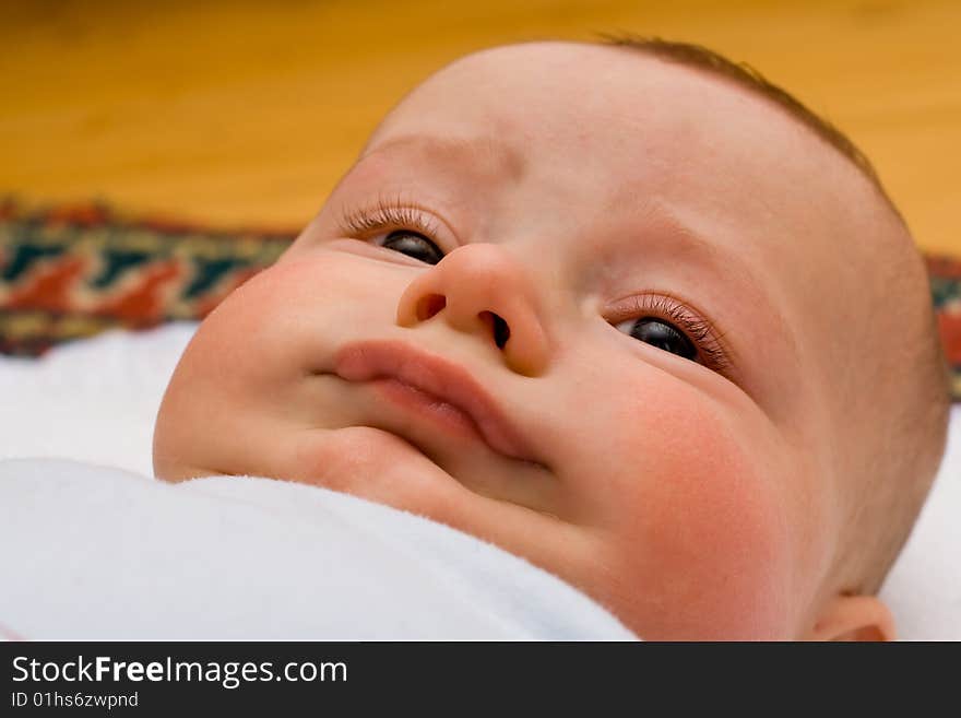 Caucasian infant making funny face