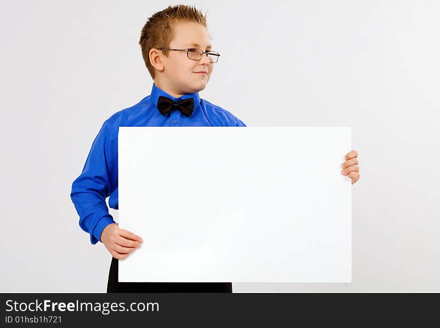 Young  boy holding an empty advertising card