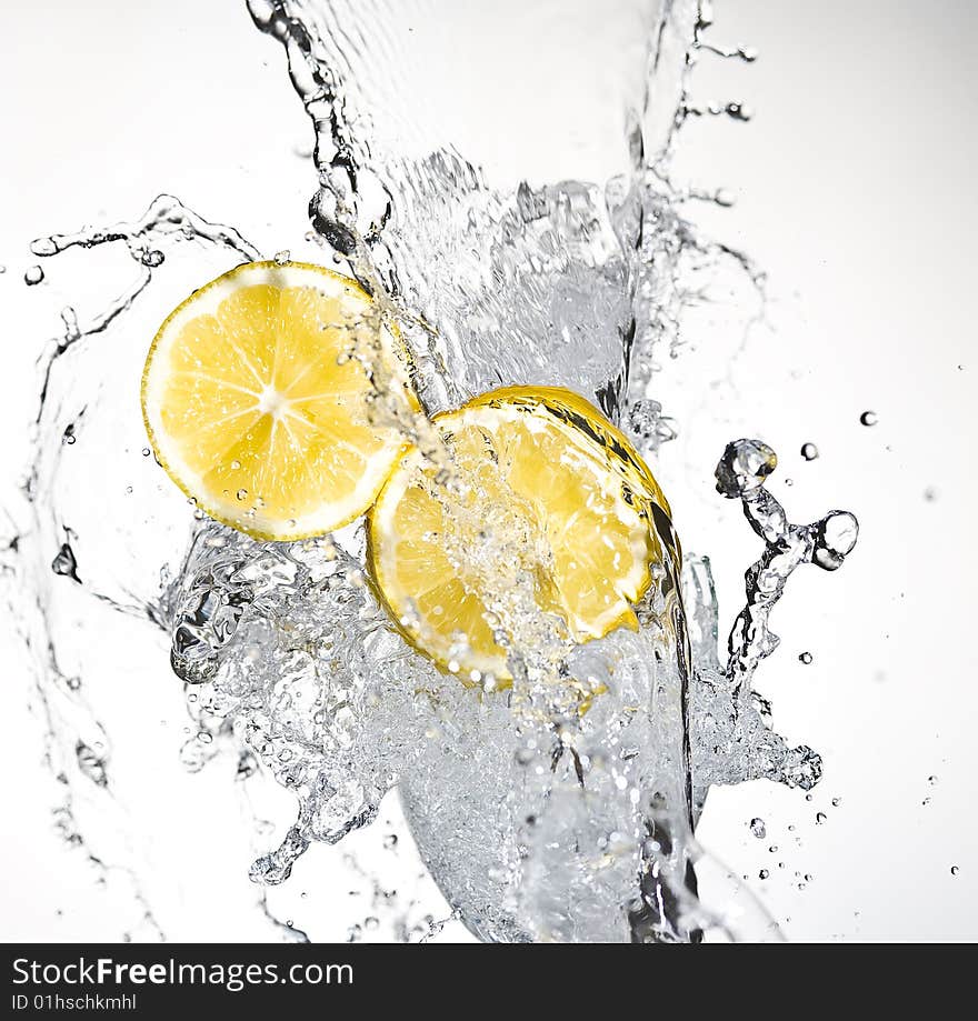 Lemon with spray water.  Creativ splashing. Lemon with spray water.  Creativ splashing