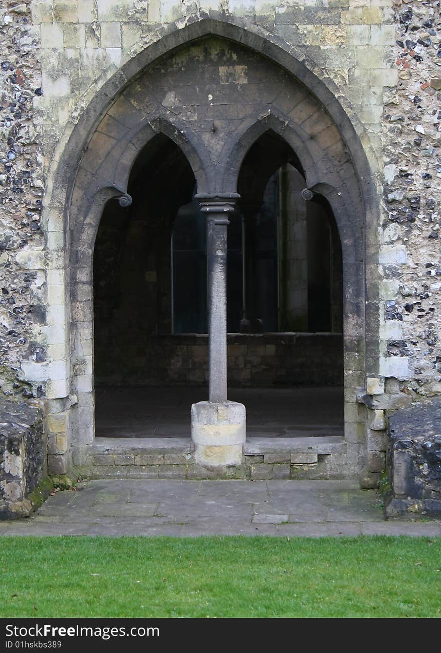 Old arched door made in stone