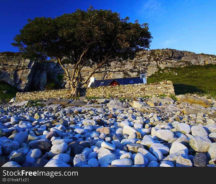 Isolated cottage and a tree at port elgol at twilight, scotland. Isolated cottage and a tree at port elgol at twilight, scotland