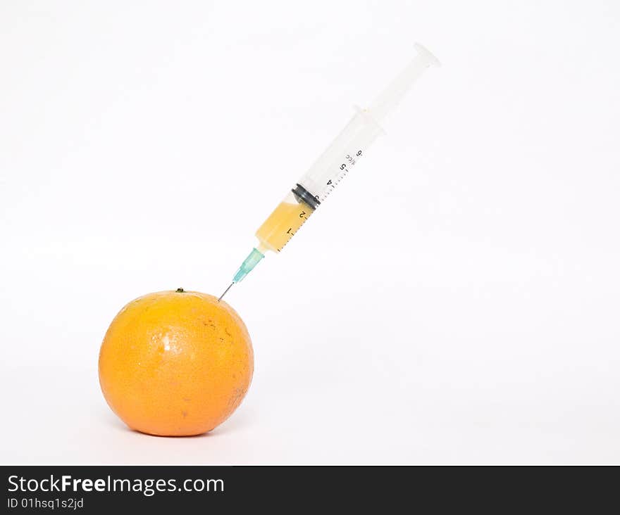 Orange with syringe
isolated on a white background