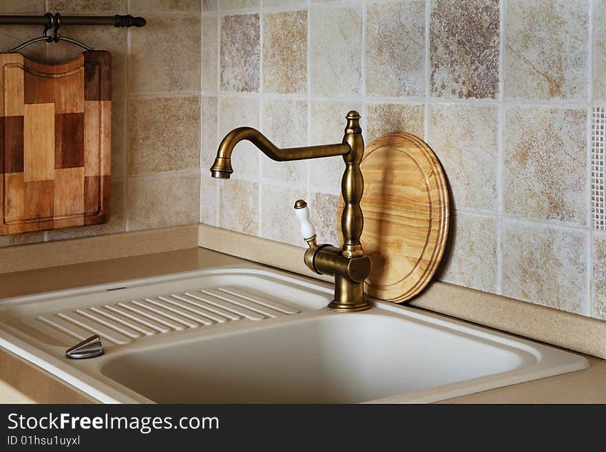 The beautiful water faucet of bronze color