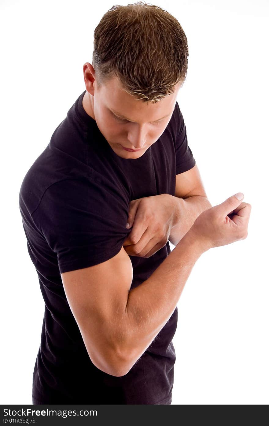 Muscular man showing his muscles on an isolated background