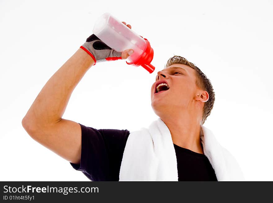 Muscular man posing with water bottle on an isolated white background