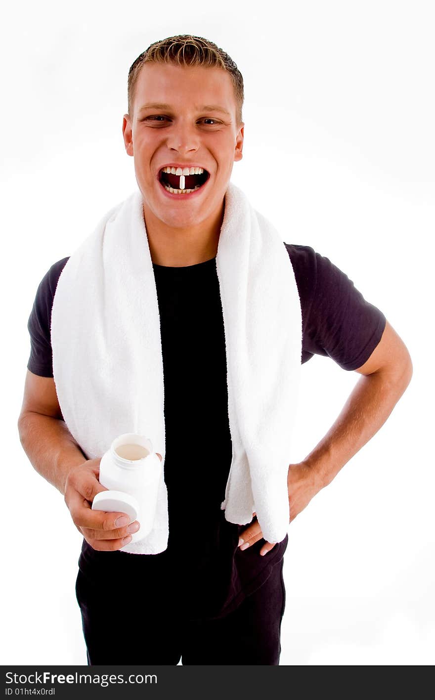 Man going to swallow medicine against white background