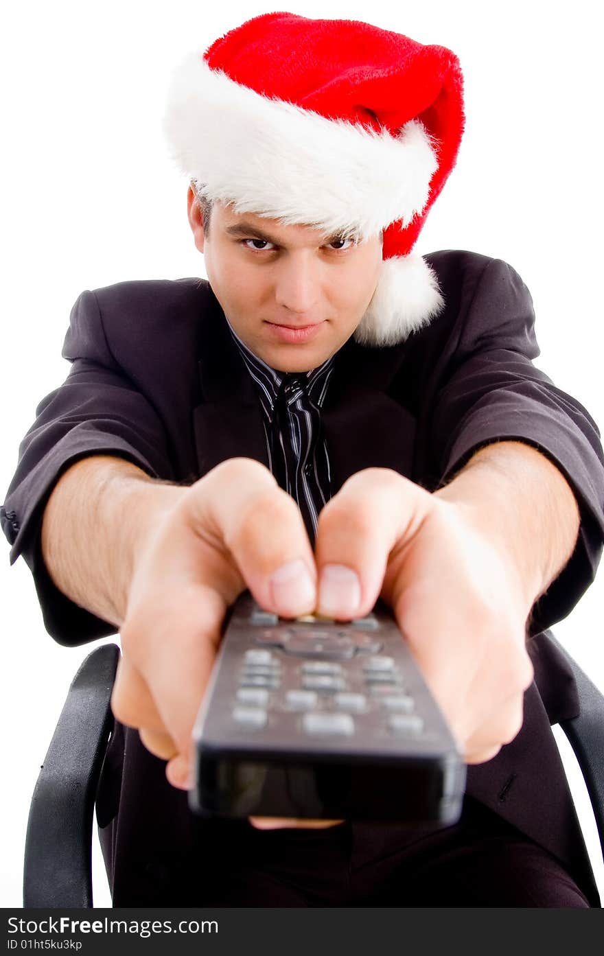 Man holding remote control and wearing hat