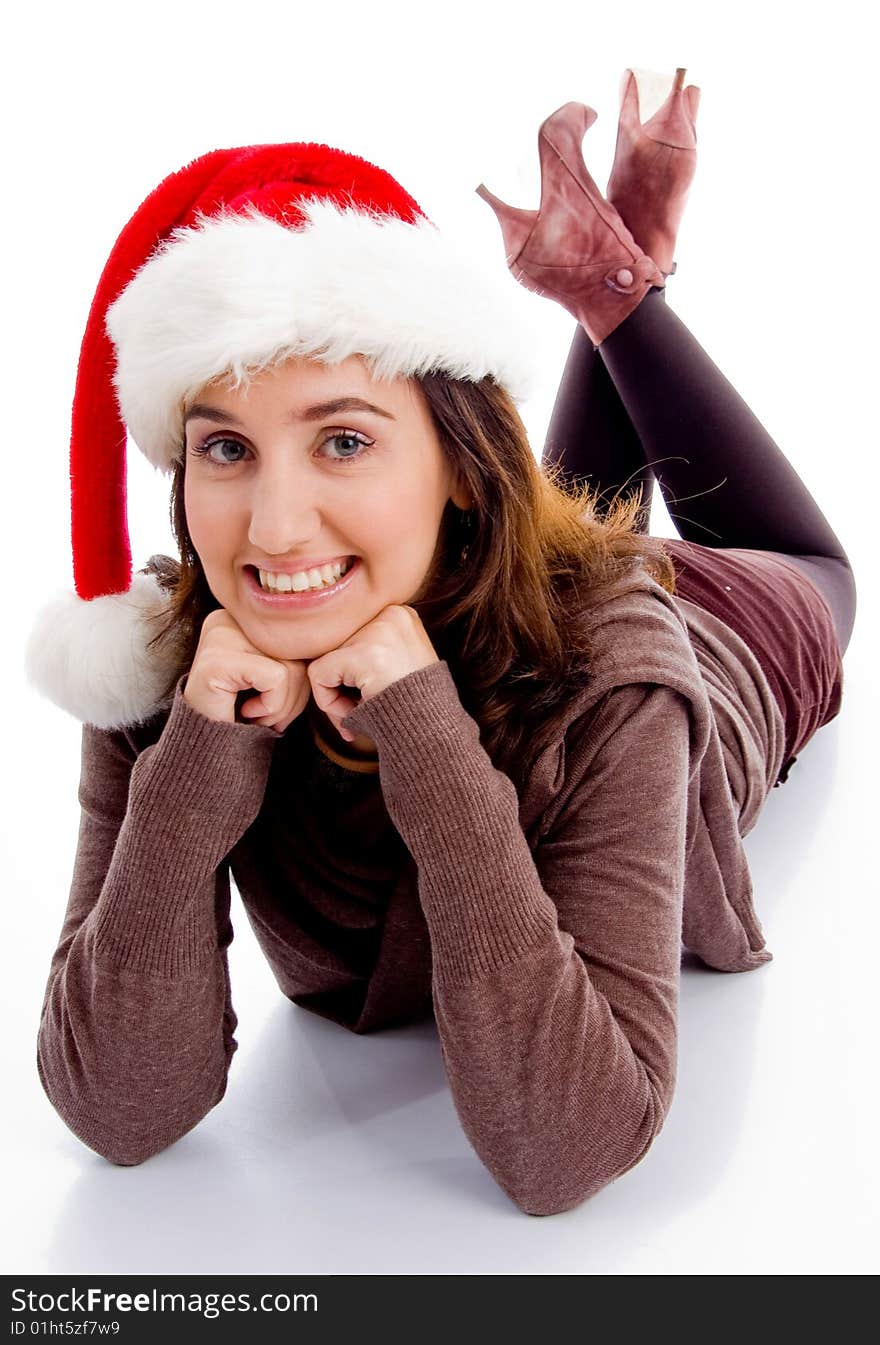 Young woman in christmas hat smiling at camera on an isolated white background