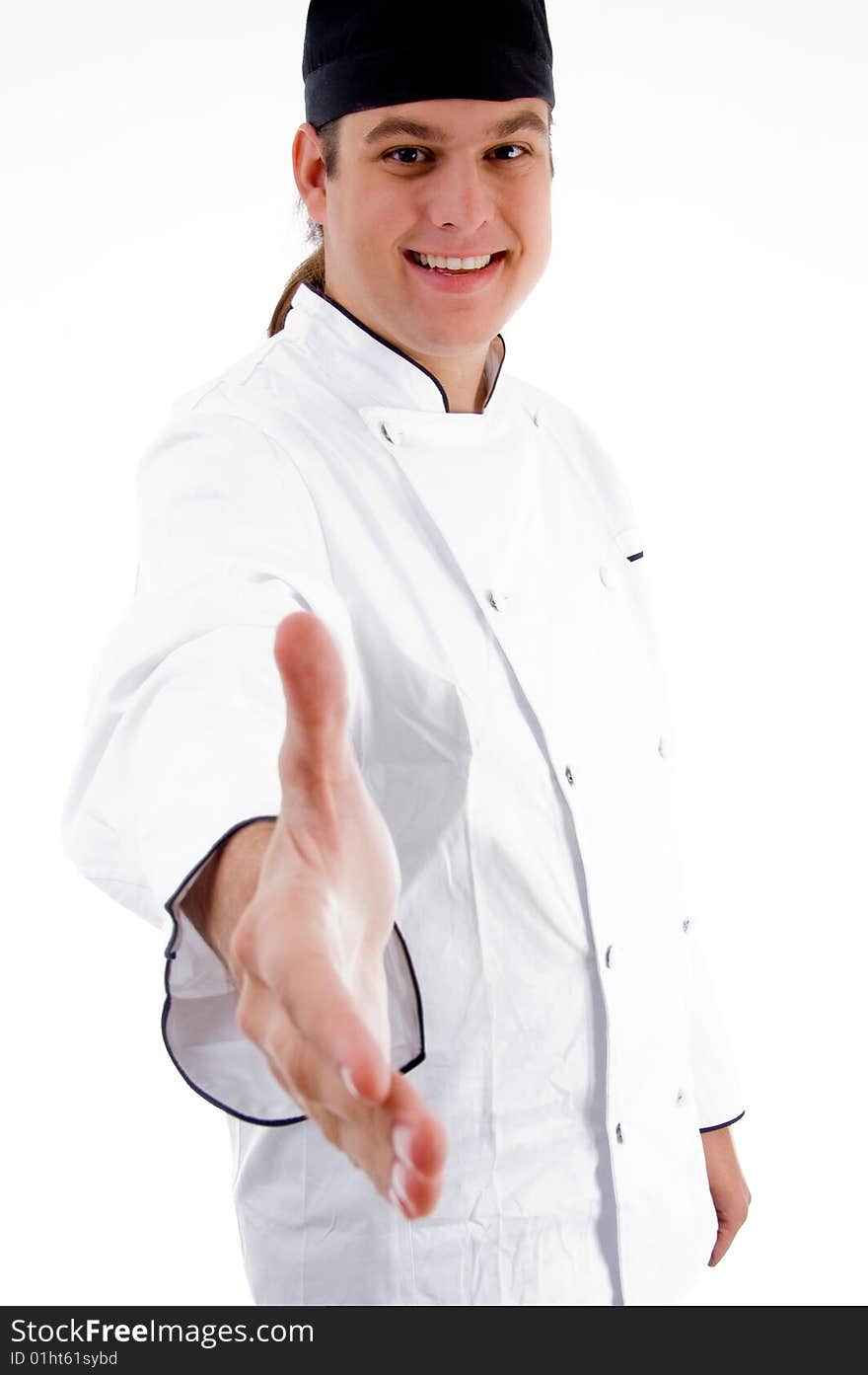 Portrait of young chef offering handshake on an isolated white background