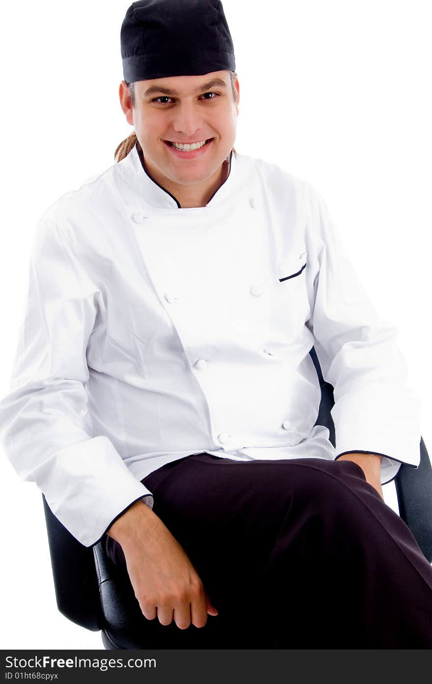 Smiling young male chef on an isolated white background