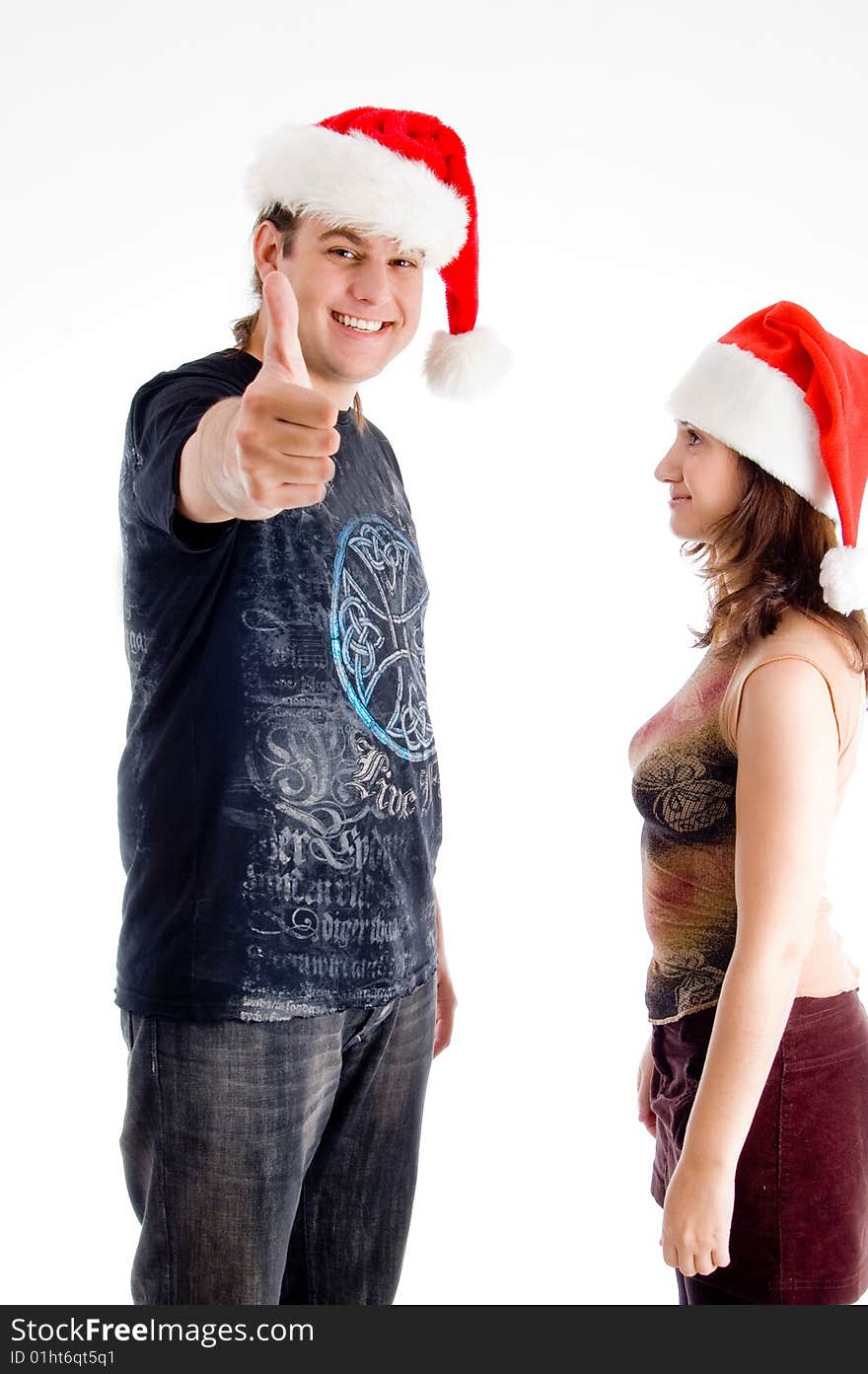 Standing couple with christmas hat on an isolated white background