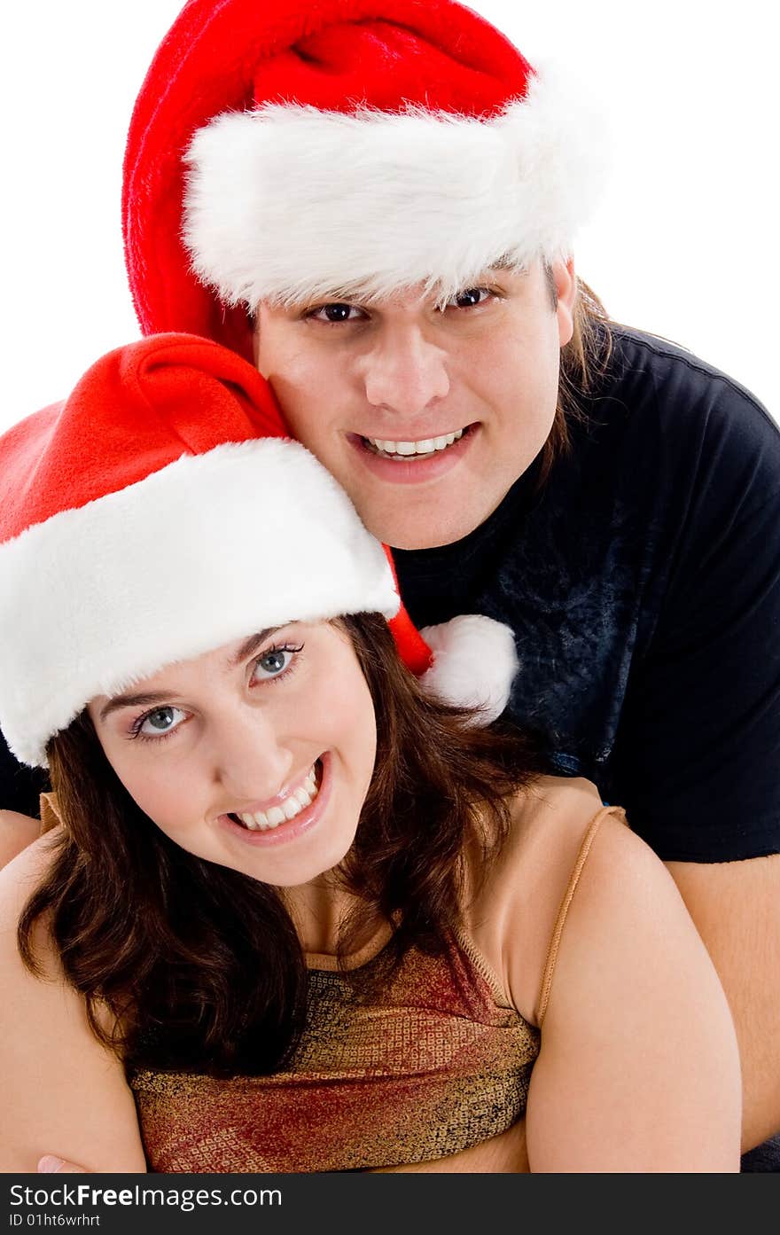 Close view of young couple with christmas hat on an isolated white background