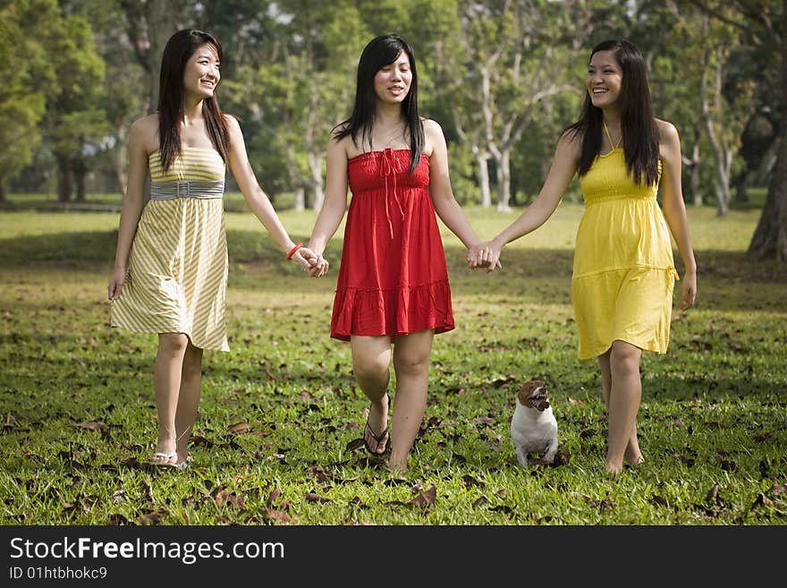 Girlfriends having some happy time together in the park. Girlfriends having some happy time together in the park