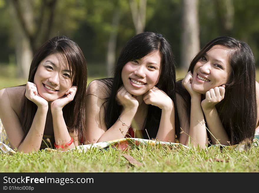 Happy girlfriends in the park