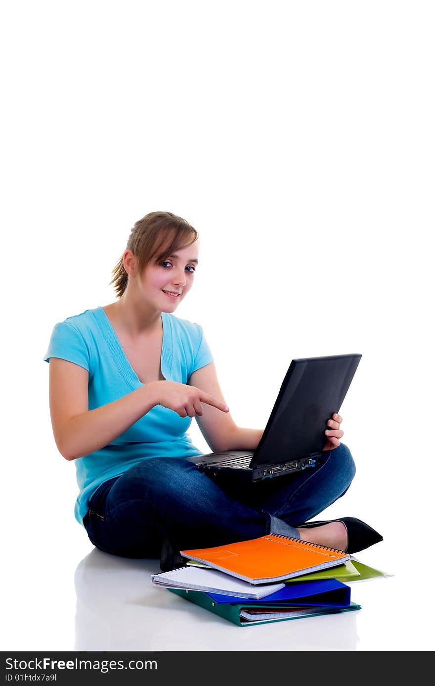 Teenager schoolgirl with laptop on white background