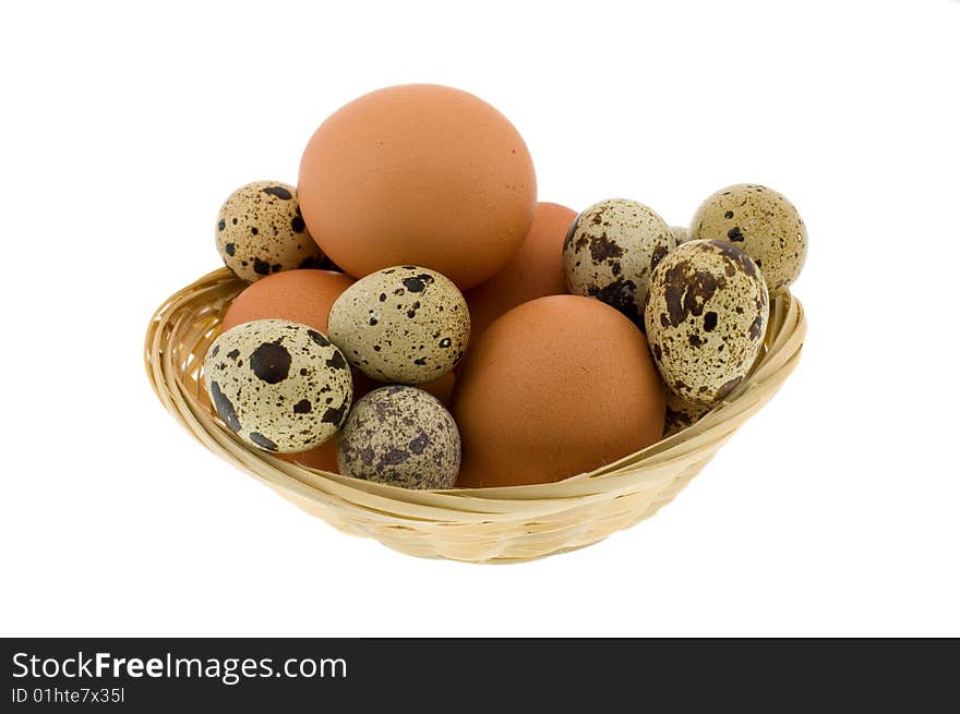 Crude eggs in basket isolated on a white background