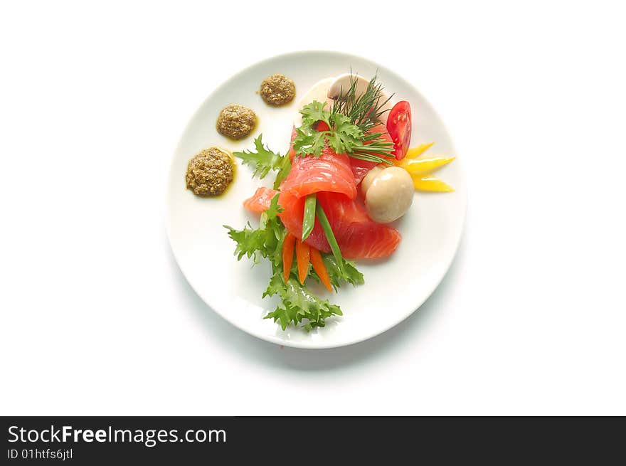 Salmon with mushrooms on a plate isolated on white background