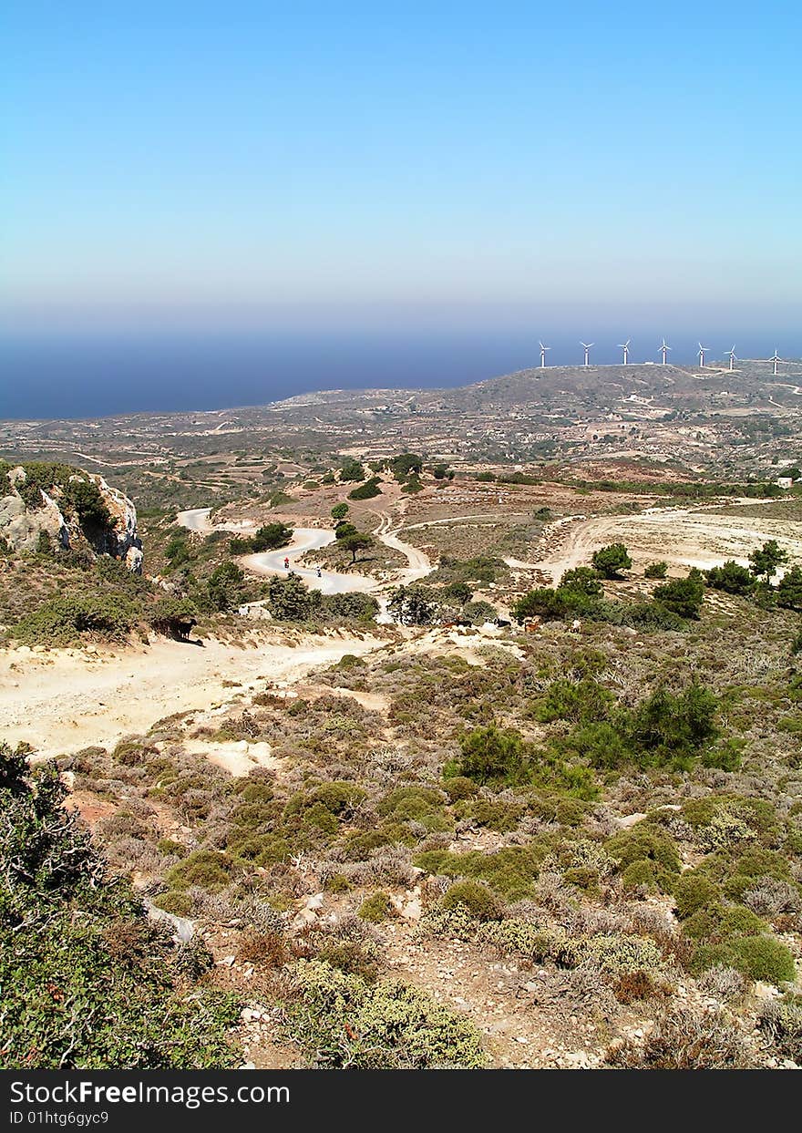 Mediterranean Scenery With Windmills On Horizon