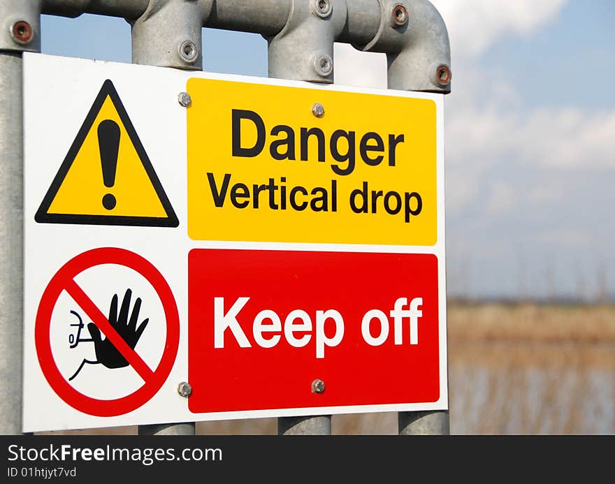 Riverbank warning signs highlight danger of deep drop. Riverbank warning signs highlight danger of deep drop