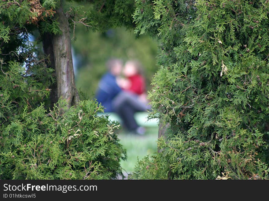 Couple kissing view in green frame. Couple kissing view in green frame