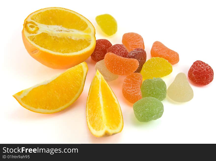 Fruit candy and orange isolated on white background