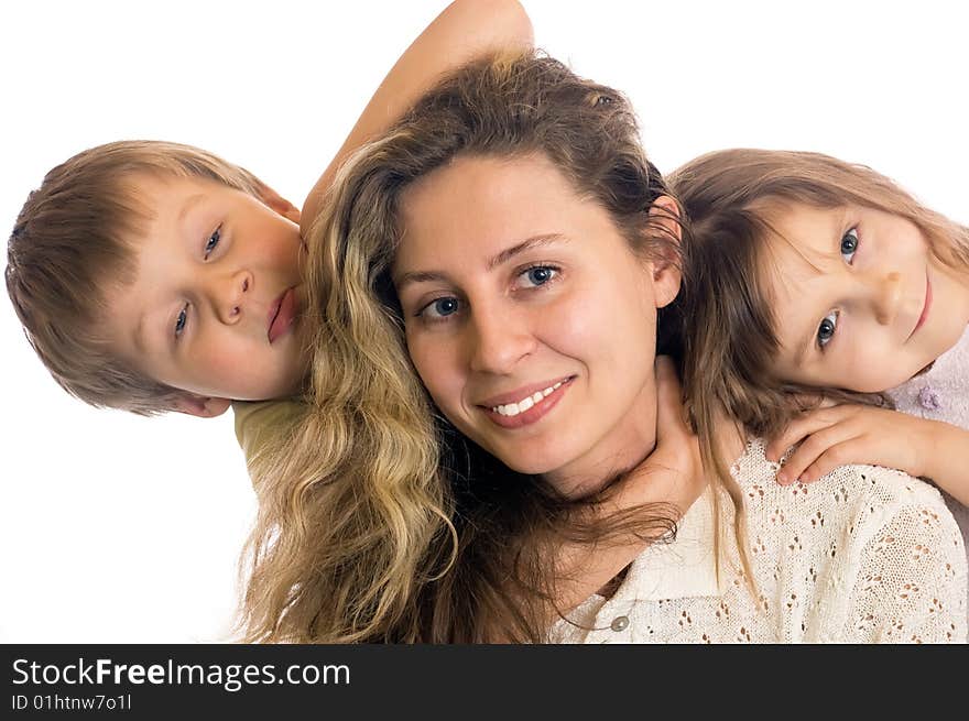 two kids and a young woman close to each other. two kids and a young woman close to each other