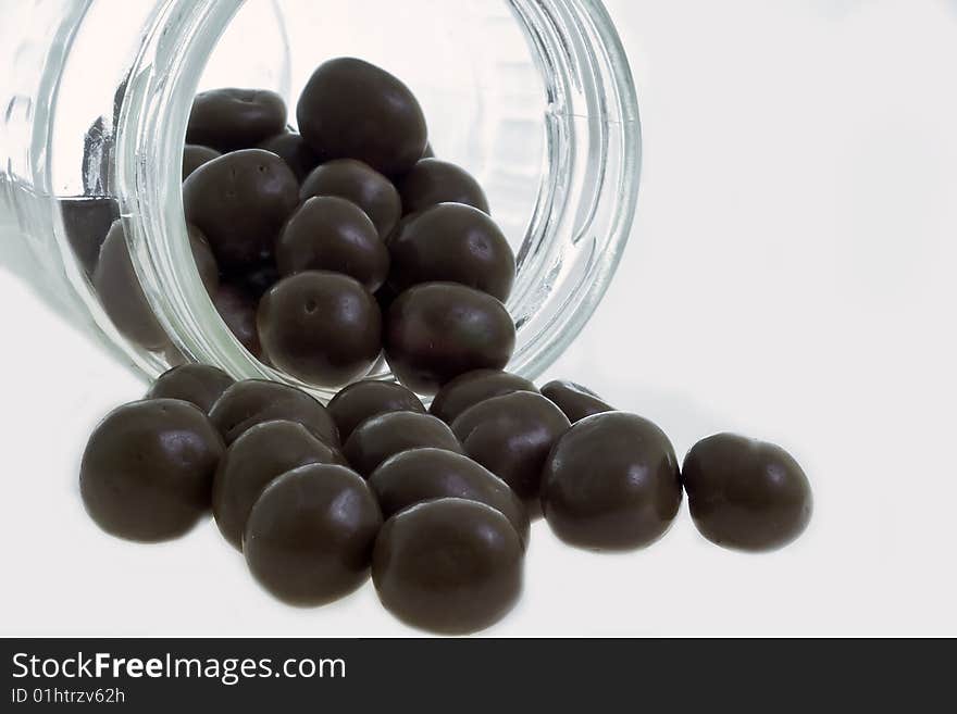 Chocolade covered nut on white background. Chocolade covered nut on white background