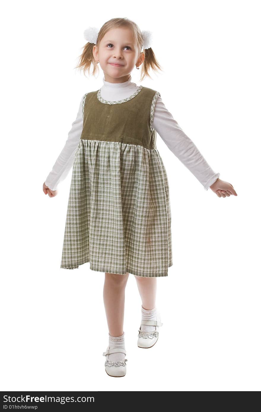 Little beautiful schoolgirl isolated on a white background. Little beautiful schoolgirl isolated on a white background