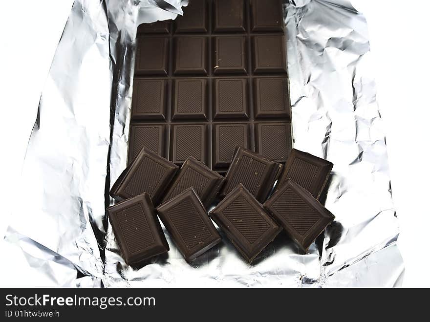 Broken chocolate on a foil