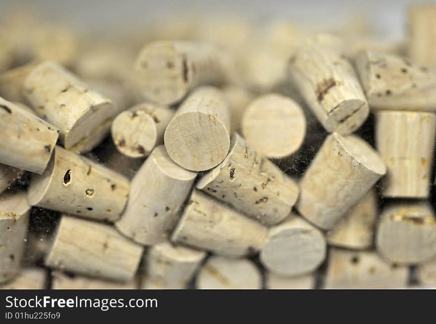 Many corks in a plastic container