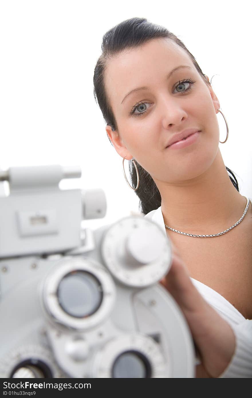 Beautiful young doctor inspect a patient in ophthalmology labor