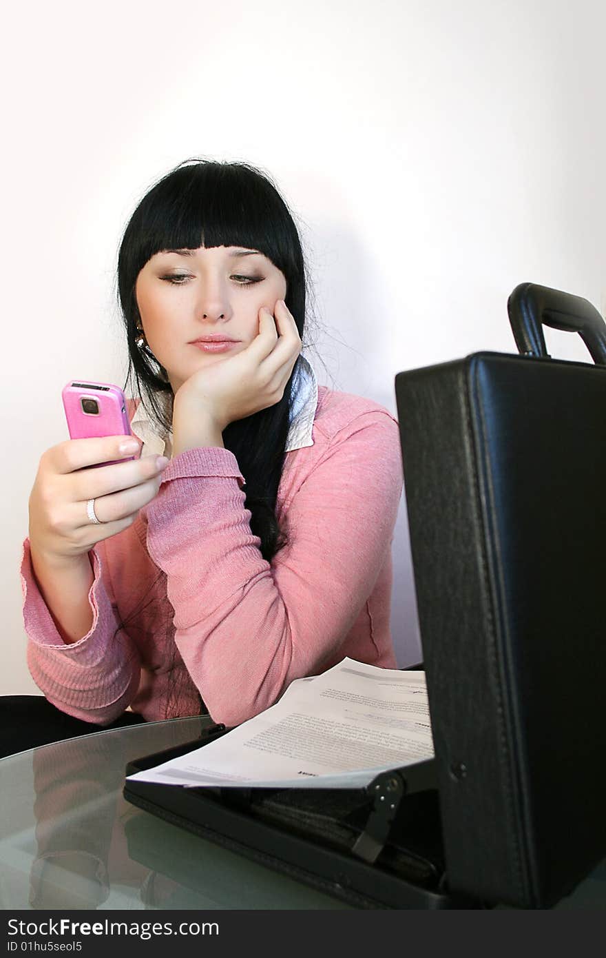 businesswoman talks on a mobile telephone