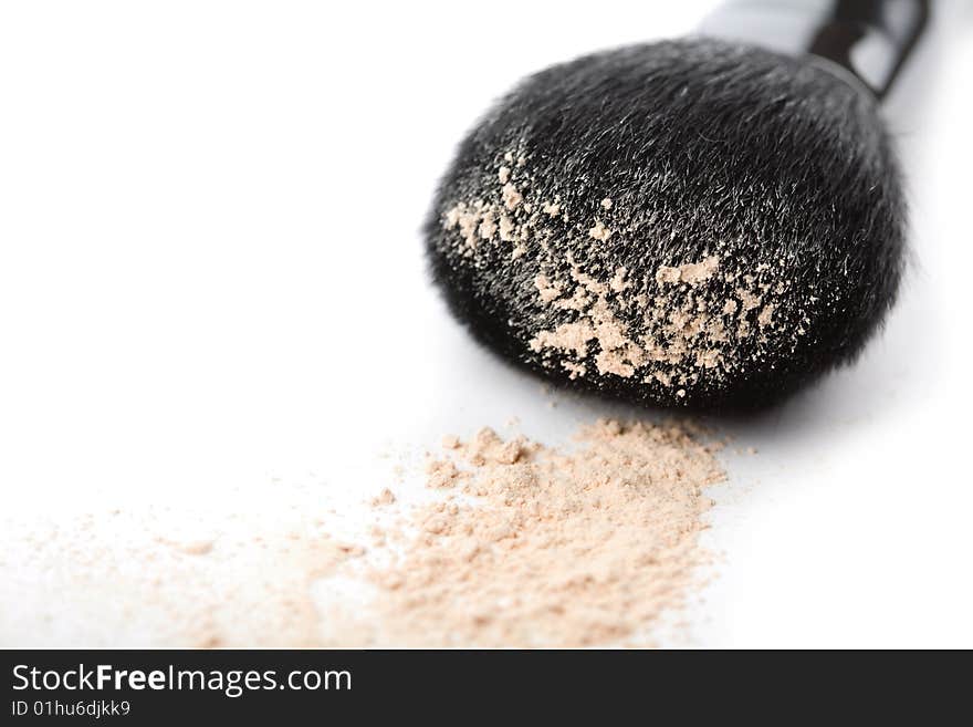 Powder and black brush isolated on white