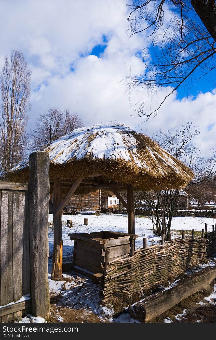 Ancient village water well with roof