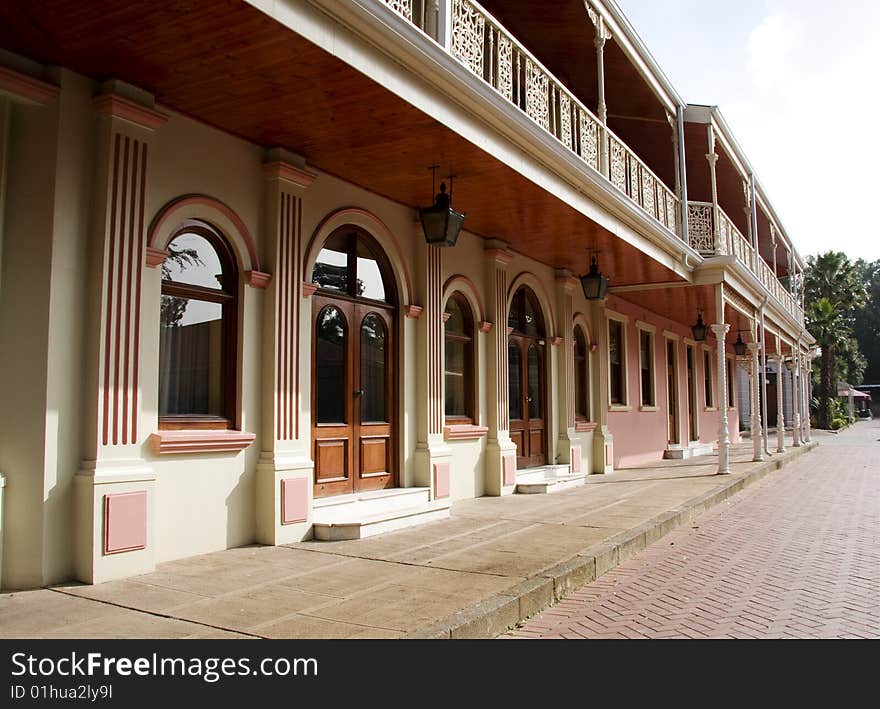 Angled view of a pink building in an old mining village in South Africa