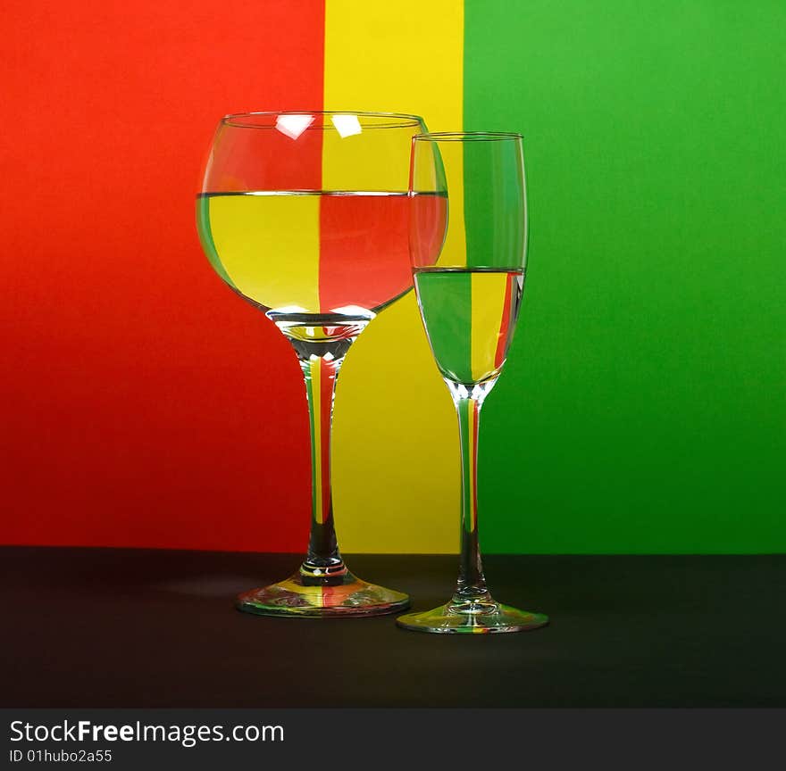 Two Wineglass On Color Background