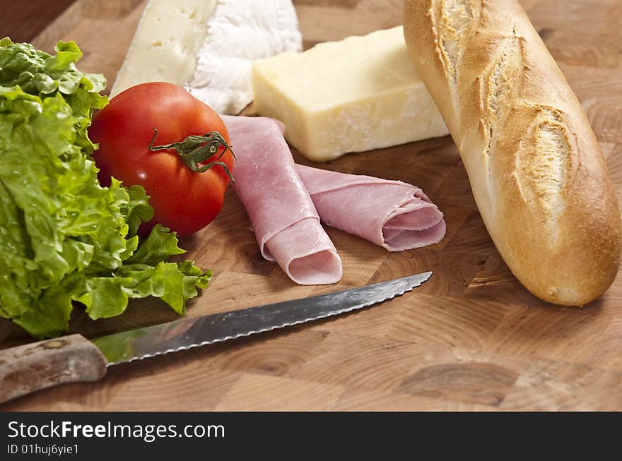 Rustic french baguette with ham and cheese. Rustic french baguette with ham and cheese