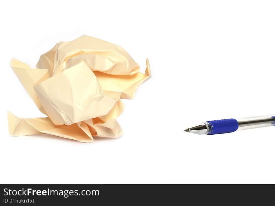 Crumpled paper ball and pen