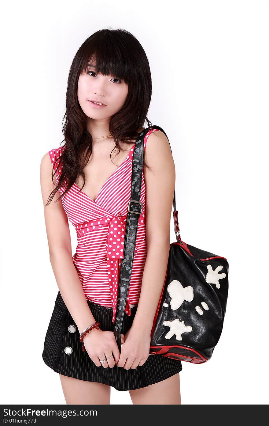 A beautiful Asian girl with handbag on white background.