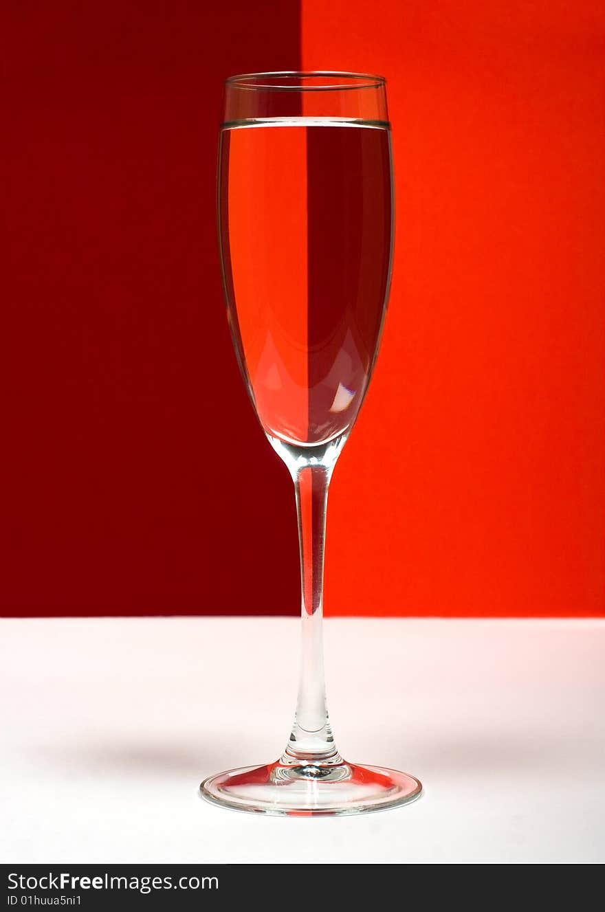 One wineglass in color background