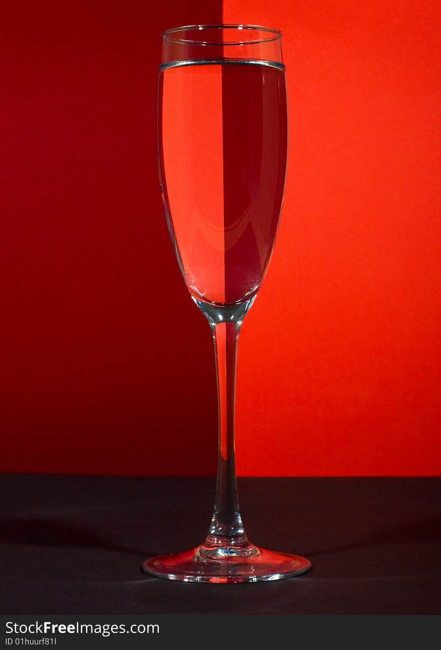 One wineglass in color background